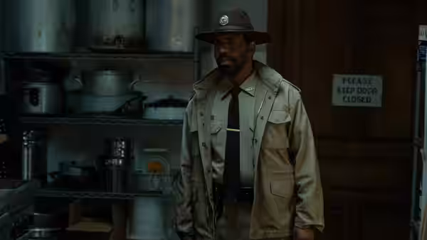 Sheriff Bechir Clemmons (Kevin T. Carroll) stands in a cluttered storage room