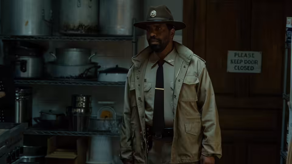 Sheriff Bechir Clemmons (Kevin T. Carroll) stands in a cluttered storage room