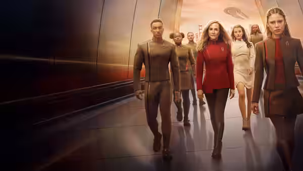 Team of officers striding purposefully along a curved metallic corridor