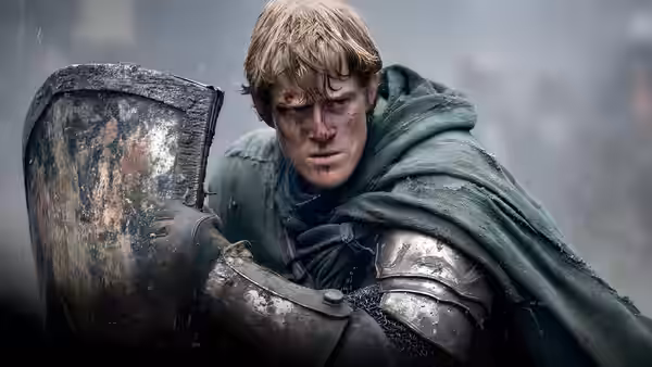 Ser Duncan the Tall (Peter Claffey) gripping a shield in dented armor