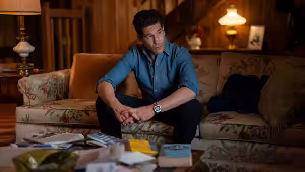 Det. Jack Harper (Jon Bernthal) sitting on a floral couch in a living room