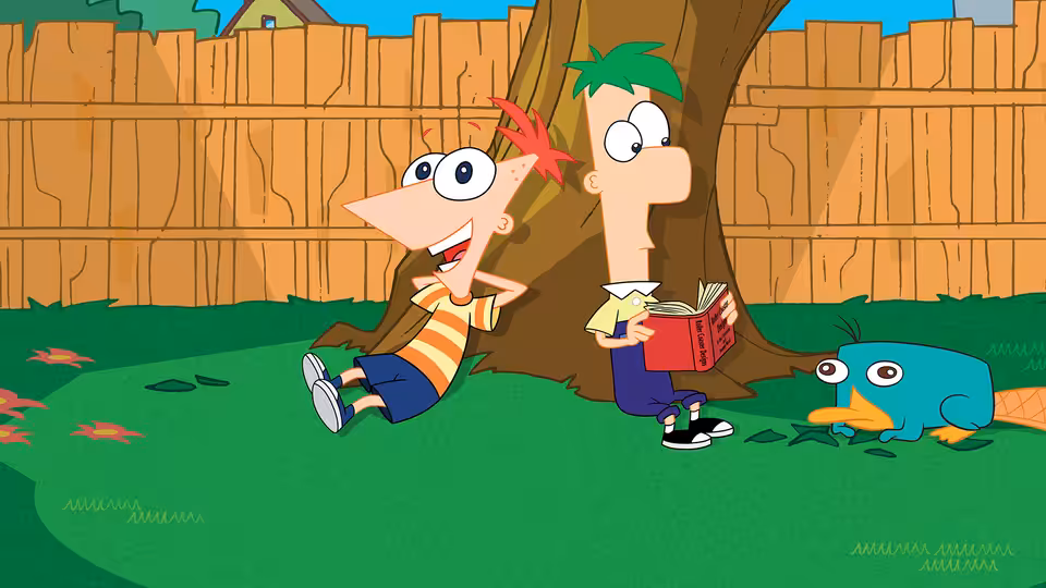 Phineas Flynn laughing beside Ferb Fletcher reading under a backyard tree with Perry