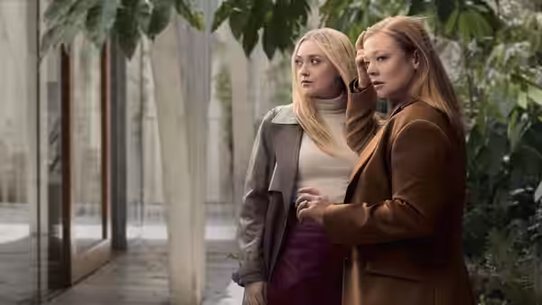 Marissa Irvine (Sarah Snook) and Jenny Kaminski (Dakota Fanning) standing under trees looking ahead