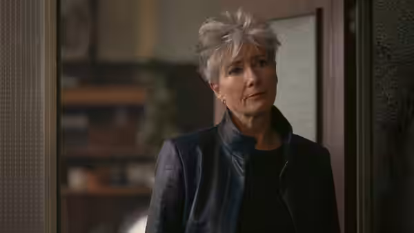 Emma Thompson as Zoë Boehm standing indoors with a concerned expression on her face