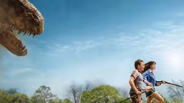 Man and woman fleeing a dinosaur across an open grassy field