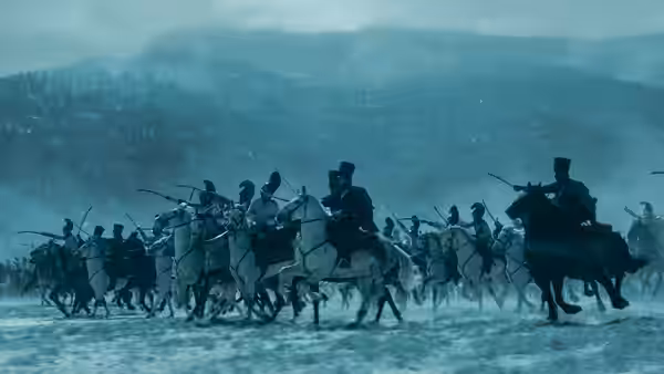 Cavalry troops advancing through a snowy landscape on horseback