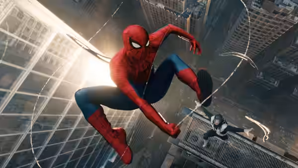 Spider-Man (Tom Holland) swings between tall buildings above a suited figure on a ledge