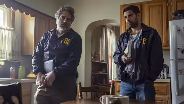 Tom Brandis (Mark Ruffalo) standing in a kitchen with Anthony Grasso (Fabien Frankel)