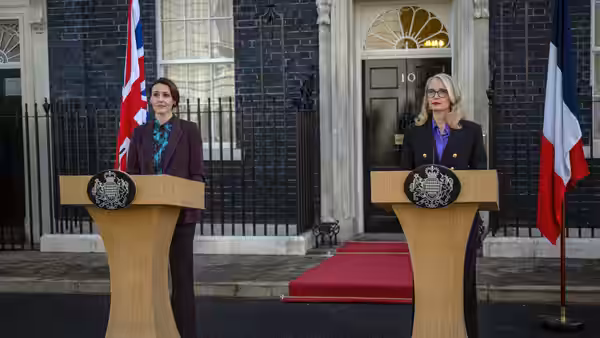 Abigail Dalton (Suranne Jones) and Vivienne Toussaint (Julie Delpy) at podiums outside Number Ten