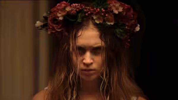 Amma Crellin (Eliza Scanlen) wearing a flower crown with wet hair