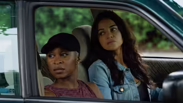 Cynthia Erivo and Michelle Rodriguez inside a car looking forward