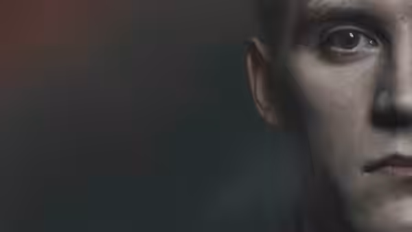 Close-up of a young soldier with short hair and serious expression