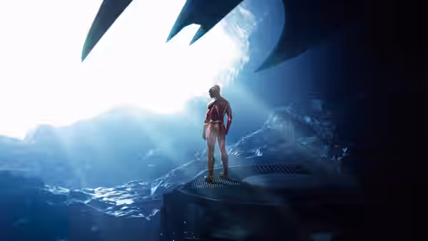 Supergirl (Sasha Calle) standing on a platform in a rocky mountainous landscape