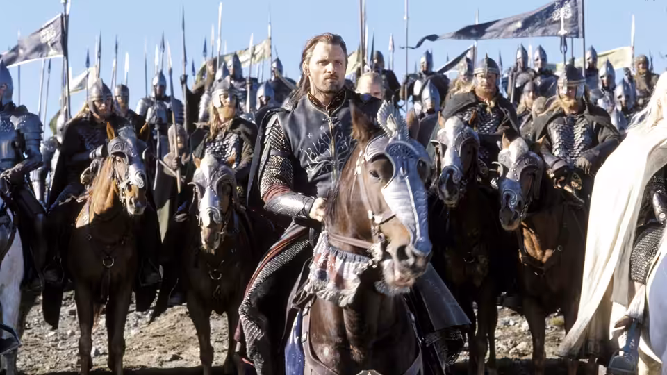 Aragorn (Viggo Mortensen) riding at the head of a mounted army