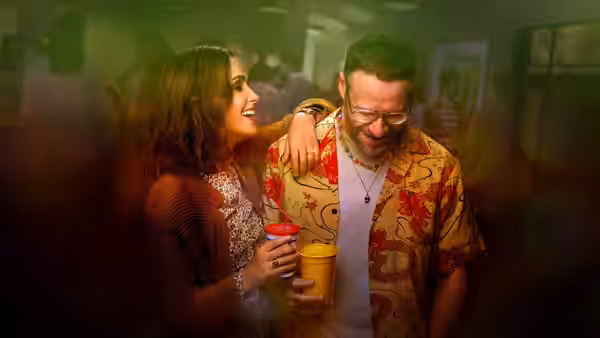 Sylvia (Rose Byrne) and Will (Seth Rogen) at a crowded party