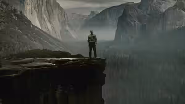 Kyle Turner (Eric Bana) standing on a cliff overlooking a misty mountain valley