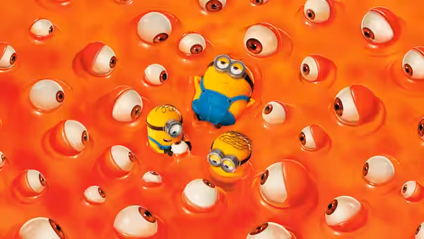Three minions floating among eyeballs in bright orange liquid