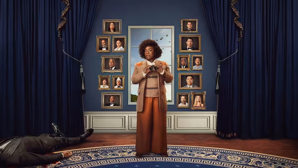 Cordelia Cupp (Uzo Aduba) stands over a body holding binoculars in a portrait-lined room