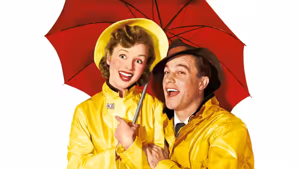 Don Lockwood (Gene Kelly) and Kathy Selden (Debbie Reynolds) under a red umbrella