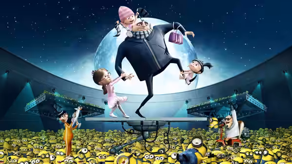 Gru (Steve Carell) balances the three girls above a crowd of Minions