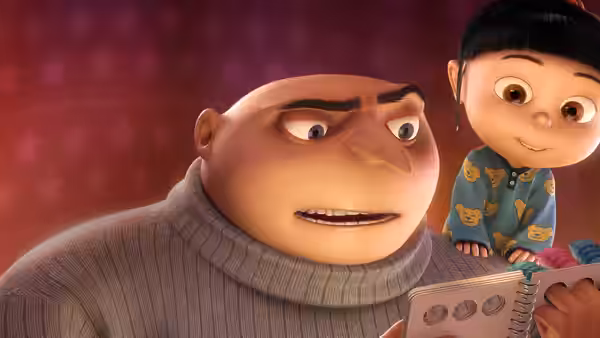 Gru (Steve Carell) reads a book with Agnes (Elsie Fisher) beside him