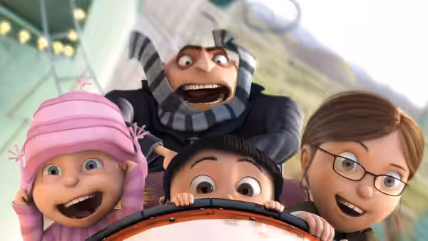 Gru (Steve Carell) and the girls ride together, laughing