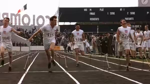 Runners sprinting to the finish line on a track at Colombes stadium