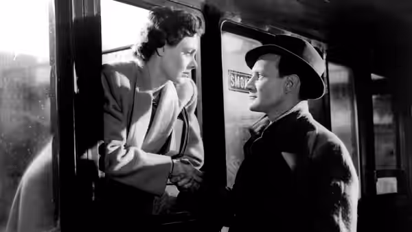 Laura Jesson (Celia Johnson) and Dr. Alec Harvey (Trevor Howard) holding hands on a train