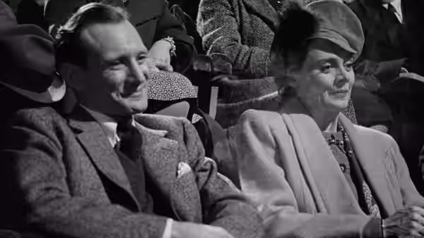 Fred Jesson (Cyril Raymond) and Laura Jesson (Celia Johnson) seated together at the cinema