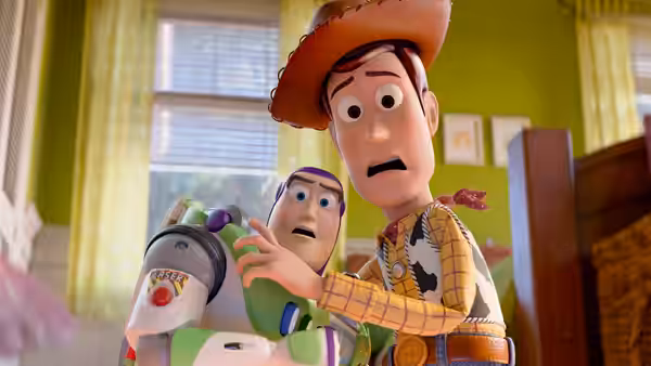 Woody and Buzz Lightyear stand in a bedroom with surprised expressions