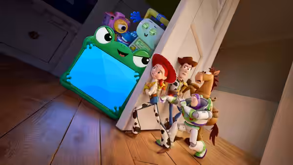 Woody Jessie Buzz and toys stand beside a large green tablet