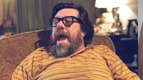 Jim Royle (Ricky Tomlinson) yawning while seated in an armchair