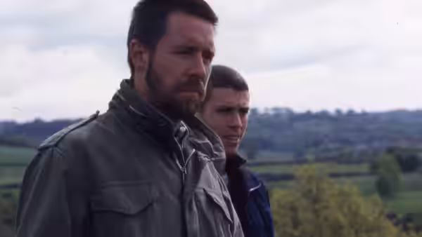 Richard (Paddy Considine) and Anthony stand together overlooking fields and hills