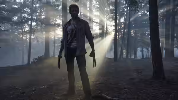 Logan (Hugh Jackman) standing among trees with claws extended
