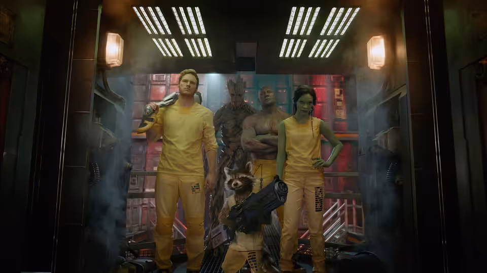 Peter Quill (Chris Pratt) with Drax, Gamora, Groot and Rocket in yellow prison uniforms