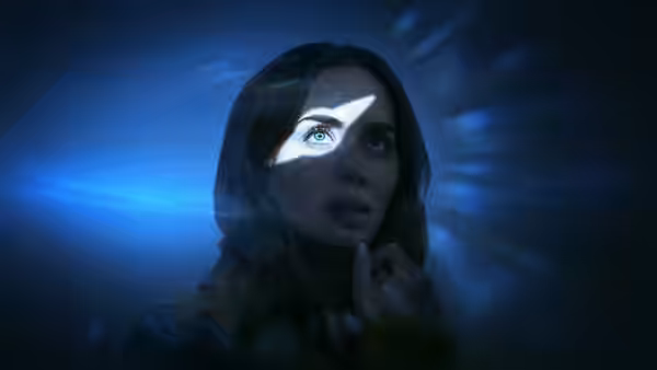 A woman stares as a bright beam crosses her face