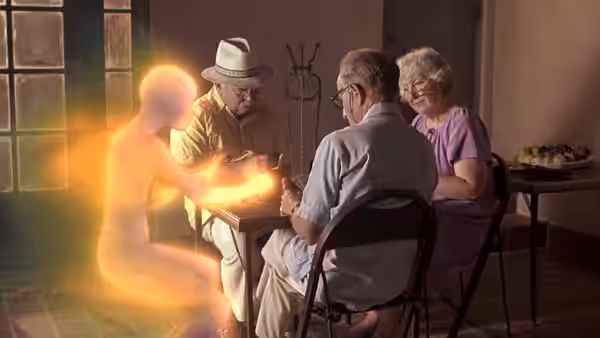 An elderly man in a hat and two companions gather around a glowing figure at a table