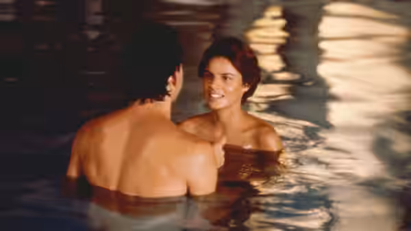 Kitty (Tahnee Welch) talks with Jack Bonner in a swimming pool