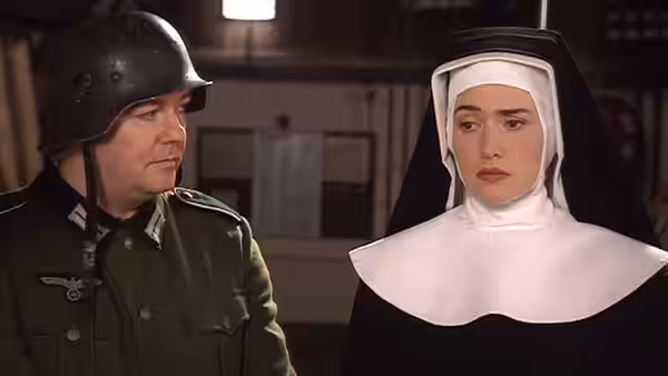 Man in German helmet and uniform stands next to a nun in habit