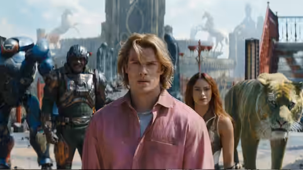 Adam (Nicholas Galitzine) stands before city with Teela (Camila Mendes) and allies