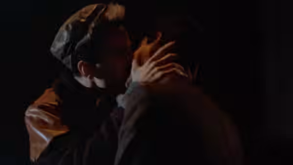 Omar (Gordon Warnecke) and Johnny (Daniel Day-Lewis) kissing in the dark