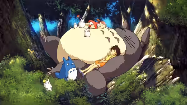Children and small creatures resting on Totoro in a forest clearing