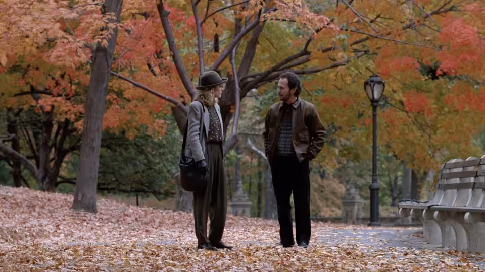 Sally (Meg Ryan) and Harry (Billy Crystal) stand facing each other in an autumn park