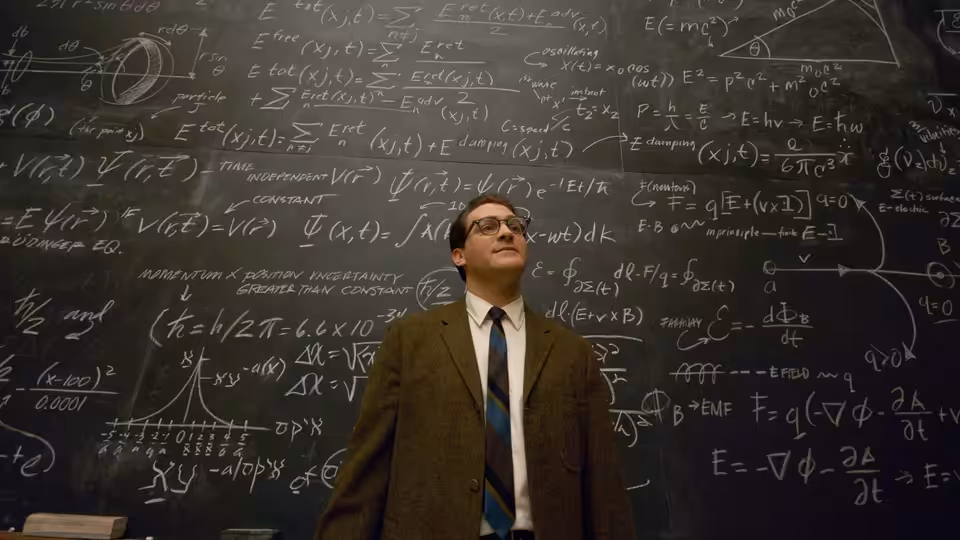 Larry Gopnik (Michael Stuhlbarg) standing before a chalkboard covered in equations