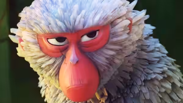 Monkey (Charlize Theron) with red face and white fur in close-up