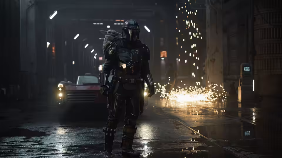 The Mandalorian walking through a wet corridor with sparks flying around