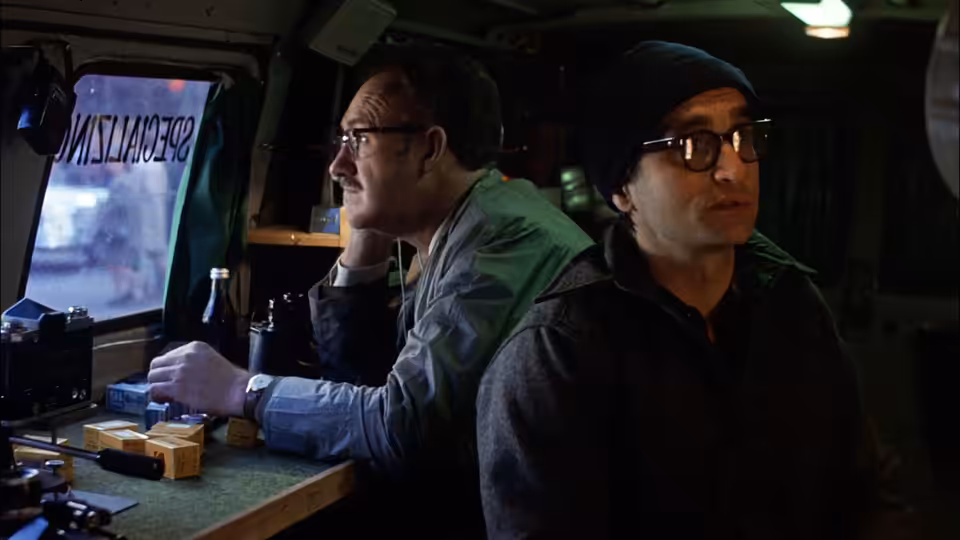 Harry Caul (Gene Hackman) and Stan (John Cazale) monitoring equipment in a surveillance van