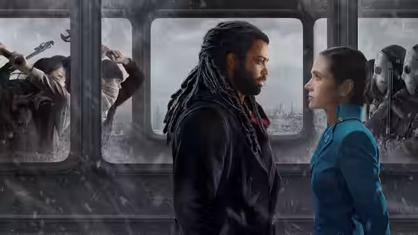 Andre Layton (Daveed Diggs) and Melanie Cavill (Jennifer Connelly) face each other in a train car