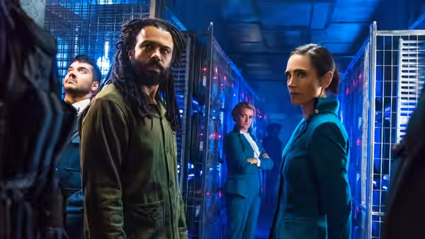 Andre Layton (Daveed Diggs) and Melanie Cavill (Jennifer Connelly) in a blue-lit cell block