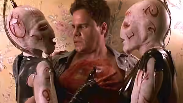 Det. Joseph Thorne (Craig Sheffer) held between two pale figures